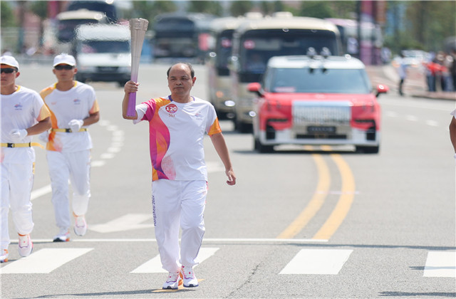 亞運(yùn)火炬手韋曉青：參與“大蓮花”建設(shè)，傳遞火炬一生難忘